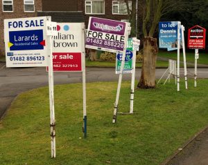Since the house sold, we don't need these for-sale signs anymore