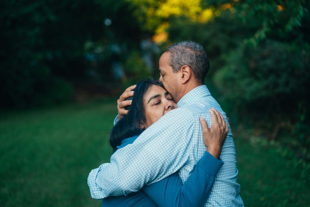 two parents hugging